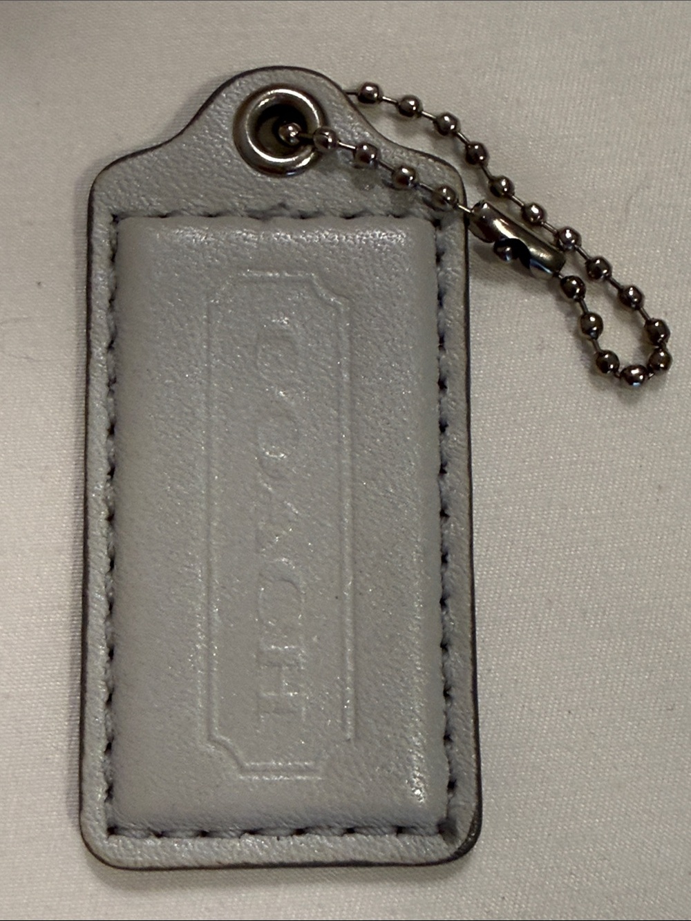 Coach “Light Gray” Leather Hang Tag (w/silver ball chain)